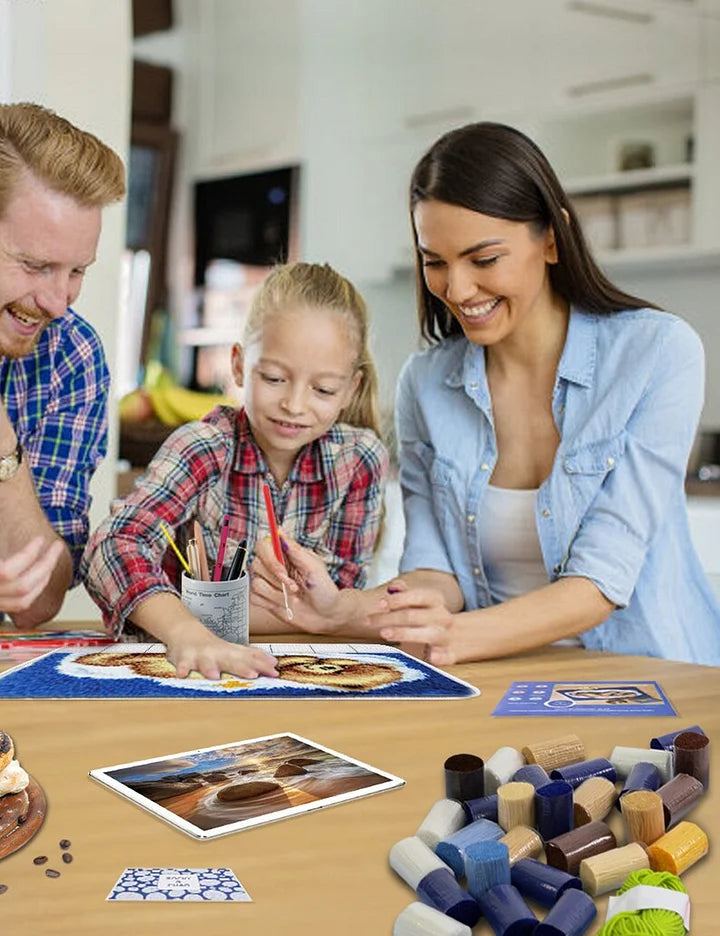 The mother is holding a little boy Latch Hook Pillow Kit for Adult, Beginner and Kid